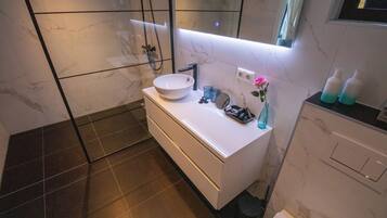 Shower, hair dryer, towels, soap