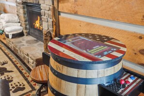A wooden barrel with a control panel featuring a star pattern and buttons. - 2BR Getaway with Hot Tub, Firepit & Outdoor TV Fun! (Gatlinburg)