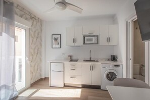 Fridge, microwave, stovetop, coffee/tea maker