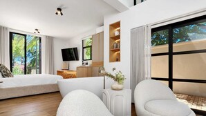 A modern living room with a large sofa, a flat-screen TV, and a wooden cabinet. - Botany House Boutique Retreat (Cape Town)