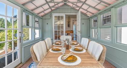 Grand home with historic charm, game room & spacious outdoor living spaces