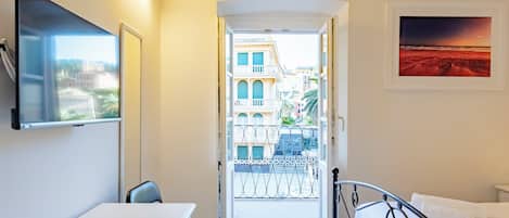 Apartment, 2 Bedrooms, Balcony, City View | 2 bedrooms, desk, laptop workspace, iron/ironing board