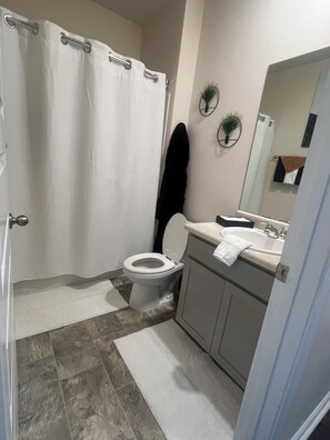 Hair dryer, towels, soap, toilet paper