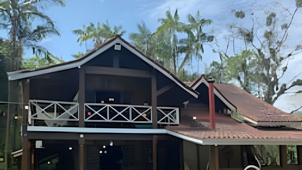 A two-story house with a swimming pool, a balcony, and a red roof. - Linda casa na Praia de Cambury - SP - 4  (Sao Sebastiao)