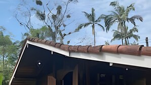 A rustic cabin with a sloped roof, a porch, and a hammock. - Linda casa na Praia de Cambury - SP - 4  (Sao Sebastiao)