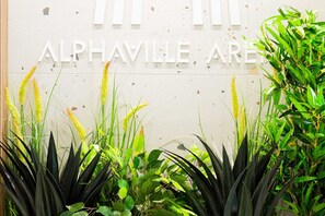 A sign reading "ALPHAVILLE AREA" with surrounding greenery. - MoHost Penthous and MoHost View (Brasov)