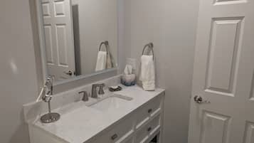 Shower, towels, soap, toilet paper