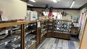 A bakery with wooden display cases filled with various baked goods.