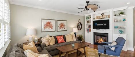 Smart TV, fireplace, books, stereo