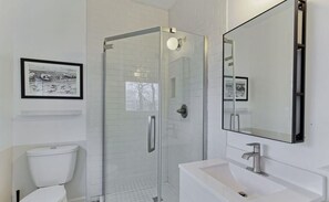 Shower, hair dryer, towels, toilet paper