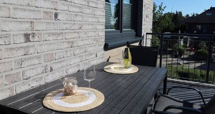 KÜSTE33/15 – Sauna. Balkon. Familienfreundlich.