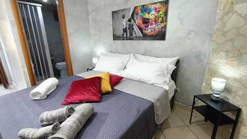 1 bedroom, desk, iron/ironing board, travel crib