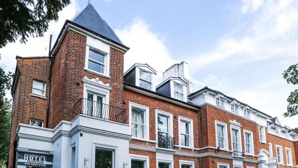 A traditional brick building with a white reception area and multiple windows. - Beckenham Park Hotel (Beckenham)