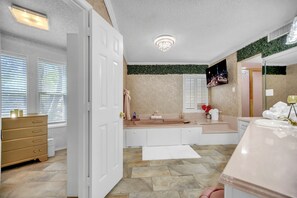 Jetted bath, hair dryer, towels, soap
