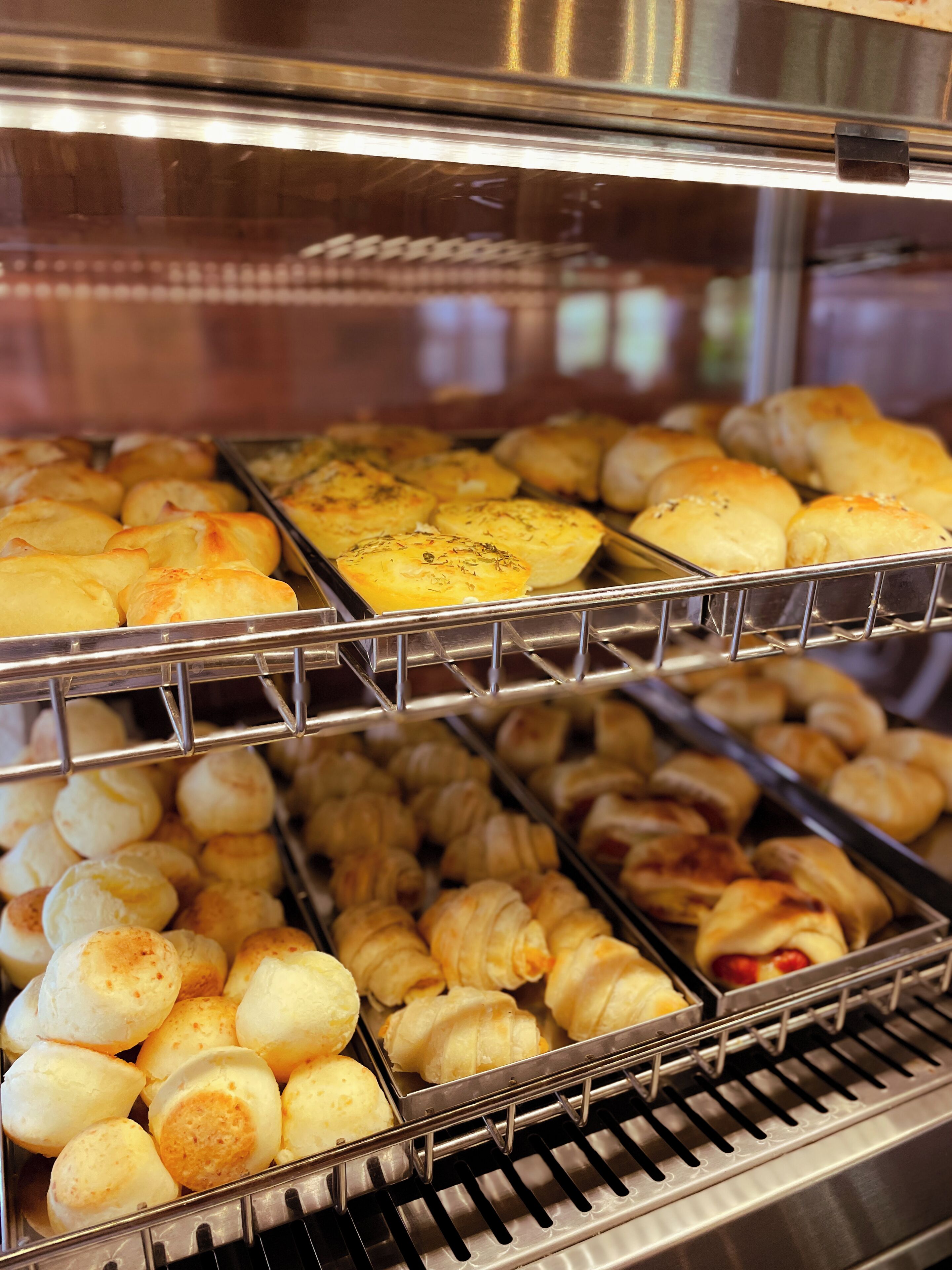 A bakery display with various baked goods.