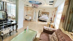 A luxurious room with a bed, a chandelier, a mirror, and a billiards table. - No.5 Theme Hotel (Yanji)