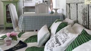 A cozy bedroom with a bed, a nightstand, a dresser, and a star decoration on the wall. - Tiny lakefront cabin at Loon Straits on Lake Winnipeg. Perfect for couples! (Loon Straits)