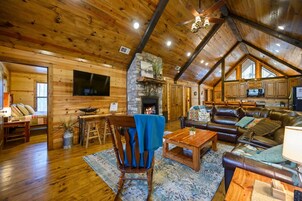 Cabin, Multiple Beds, Hot Tub, Garden View (Whitetail Retreat) | Living area | 55-inch flat-screen TV with digital channels, fireplace