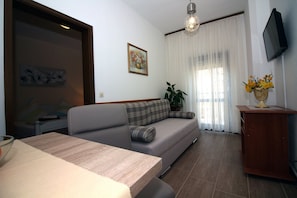 Apartment (One Bedroom Apartment Ground Floor) | Living room | 32-inch flat-screen TV with satellite channels - Zadar Coastal Haven (Zadar)