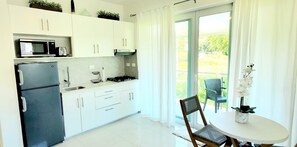 Fridge, microwave, stovetop, coffee/tea maker