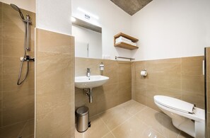 Shower, hair dryer, towels, toilet paper