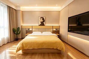 A modern hotel room with a large bed, bedside tables, a flat-screen TV, and a large window with curtains.