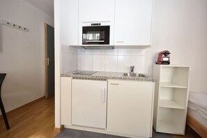 Fridge, microwave, stovetop, coffee/tea maker