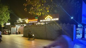 A building with a sign for 'DM (P) Guest House' and 'Desi Mandapam'. - DM PAYING GUEST HOUSE (VARANASI)