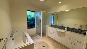Shower, hair dryer, towels, shampoo