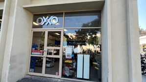 A building with a large glass storefront labeled "OXKO".