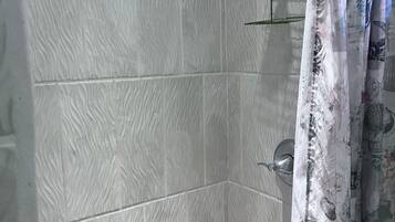 Shower, towels, soap, toilet paper