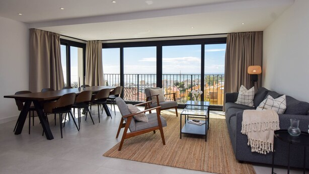A spacious living area with a dining table, chairs, a sofa, and a coffee table. - Ref: 281 Stunning villa with private pool (Fuengirola)