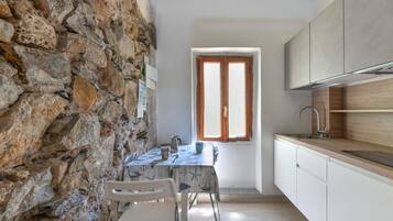 Fridge, stovetop, coffee/tea maker, cookware/dishes/utensils