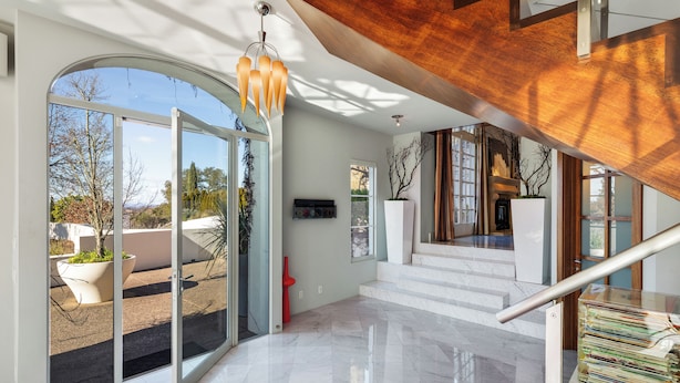 A modern interior with a glass door leading to an outdoor area, a staircase, and a wooden ceiling. - Modern Santa Rosa Retreat Near Wineries & Trails (Santa Rosa)