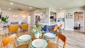 A spacious living room with a dining area, a kitchen, and a bedroom. - Private Pool + Putting Green: Sunny Scottsdale Gem (Scottsdale)