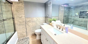 Shower, hair dryer, towels, soap