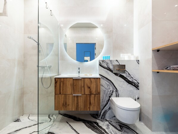 Shower, hair dryer, towels, soap