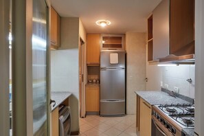 Fridge, coffee/tea maker, cookware/dishes/utensils