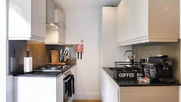 Coffee/tea maker, fridge, microwave, oven