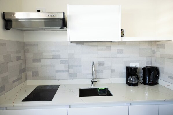 Fridge, microwave, stovetop, coffee/tea maker
