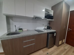 Microwave, stovetop, coffee/tea maker, electric kettle