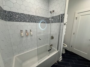 Shower, hair dryer, towels, soap