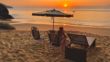 On the beach, beach shuttle, sun-loungers, beach umbrellas