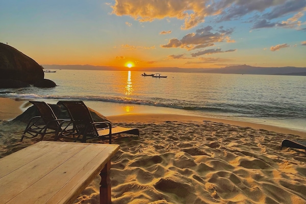 On the beach, beach shuttle, sun-loungers, beach umbrellas