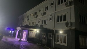 A multi-story hotel with a central entrance, multiple windows, and air conditioning units. - The CEO hotel and suite  (Ibadan)