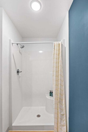 Shower, hair dryer - Craft District Apt w/ Gym & Coffee Shop 307 (Duluth)