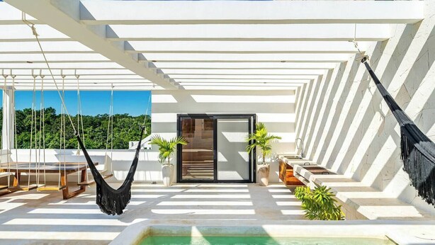 A rooftop terrace with a pool, hammocks, and potted plants. - New Spacious Villa with Rooftop dipping pool (Tulum)