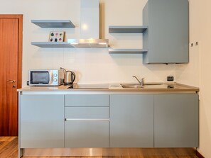 Fridge, microwave, cookware/dishes/utensils
