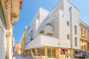 A modern building with a flat facade, large windows, and a ground-level entrance. - Bed & Breakfast in Brindisi with 1 bedrooms sleeps 2 (Brindisi)