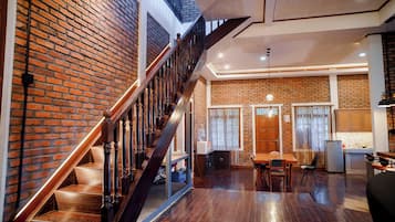 Villa estándar, vista al jardín | Área de sala de estar